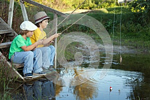 Happy boys go fishing on the river, Two children of the fisher w