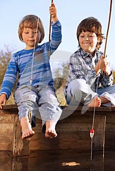 Happy boys go fishing on the river, Two children of the fisher w