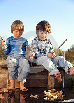 Happy boys go fishing on the river, Two children of the fisher w