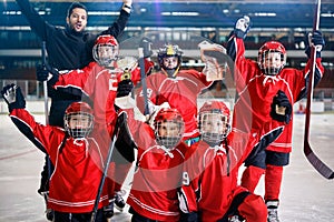 Happy boys players team ice hockey winner trophy