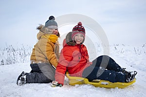 Happy boys on sled