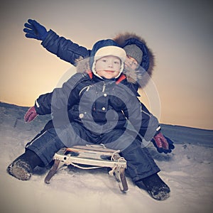 Happy boys on sled