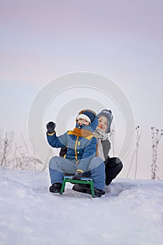 Happy boys on sled