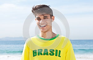 Happy brazilian sports fan at beach