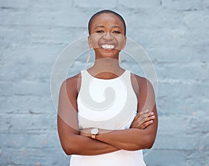 Happy, brick wall and portrait of a black woman with arms crossed, pride and smiling with confidence. Smile, confident