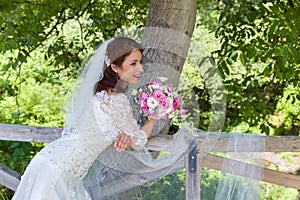 Happy bride in garden