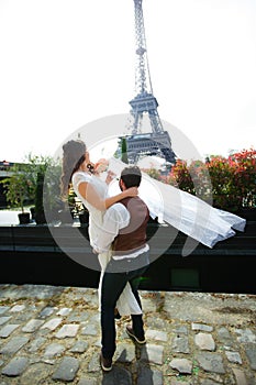Happy bride and groom enjoying their wedding in Paris