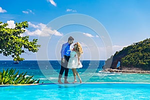 Happy bride and groom having fun on a tropical beach