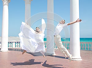 Happy bride and groom in jump photo