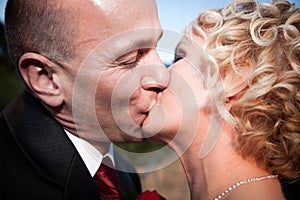 Happy bride and groom kissing