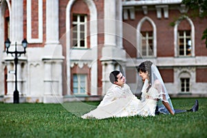 Happy bride and groom on lawn