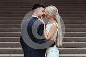 Happy bride and groom near old castle