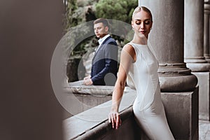 Happy bride and groom near old castle