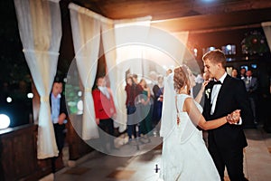 Happy bride and groom a their first dance, wedding