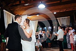 Happy bride and groom a their first dance, wedding