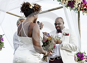Happy bride and groom in a wedding ceremony at a tropical island