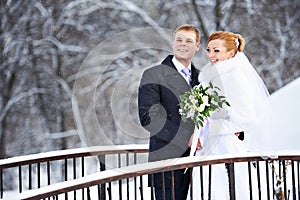 Happy bride and groom on winter day