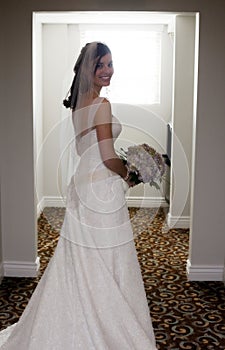 Happy bride in hallway