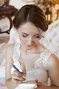 Happy bride holding her shoe