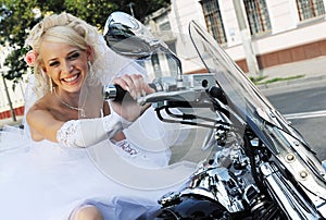 Happy bride on a motorbike