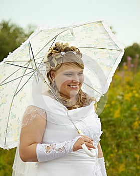 Happy bride with a parasol