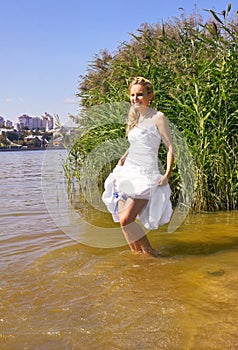 Happy bride in river