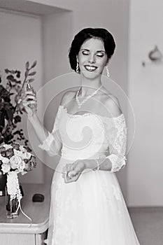 Happy Bride spraying perfume