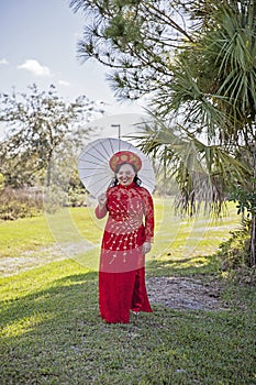 Happy bride wearing Vietnamese Ao Dai