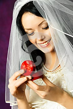 Happy bride with a wedding ring