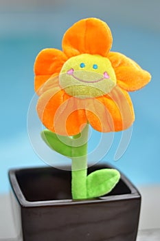 Happy Bright Orange Toy Flower in Plant Pot
