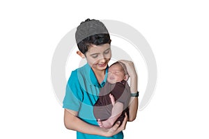 Happy brother holding a newborn baby boy in his arms on the white background. Brothers, family, friends. Newborn photosession.