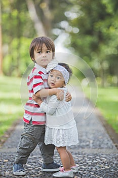 Happy brother and sister embracing each other