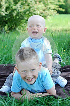 Happy brothers outdoors in summer