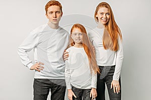 Happy brothers and sisters with red hair