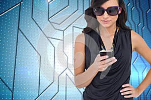 Happy brunette using smartphone