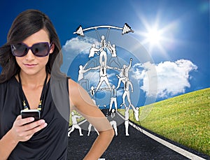 Happy brunette using smartphone