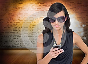 Happy brunette using smartphone