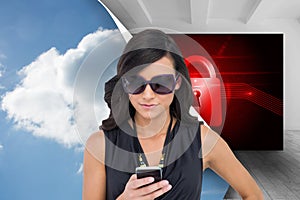 Happy brunette using smartphone