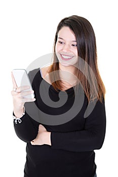 Happy brunette woman writing message on smartphone over white background