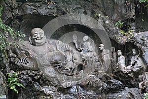 Happy buddha rock scupture