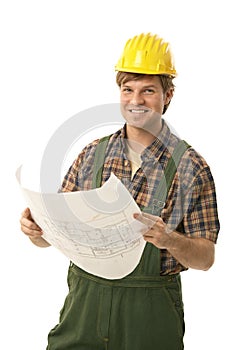 Happy builder holding floor plan