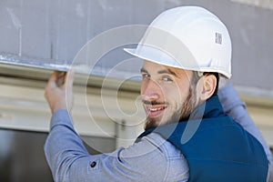 happy builder smiling at camera