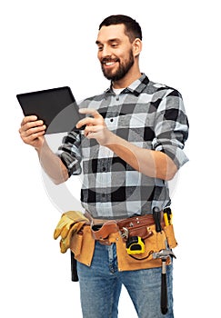 Happy builder with tablet computer and tools