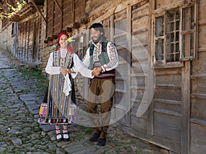 Happy Bulgarian couple dancing