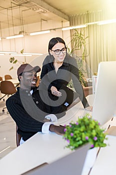 Happy business colleagues in modern office. Team of successful business people having a meeting in executive. Couple in modern