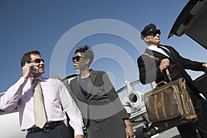 Happy Business Couple At Airfield photo