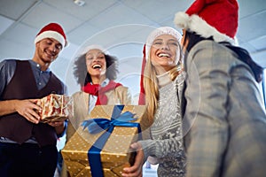 Happy business group people in santa hat at Xmas corporate party