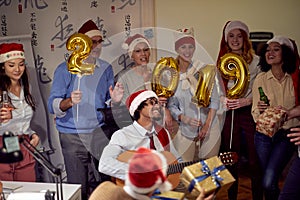 Happy business group people in Santa hat at Xmas party