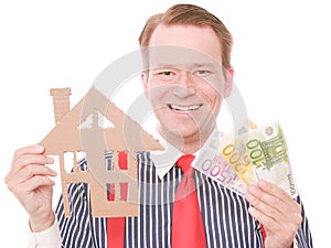 Happy business houseowner with money