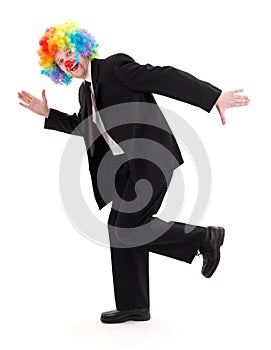 Happy business man with clown wig